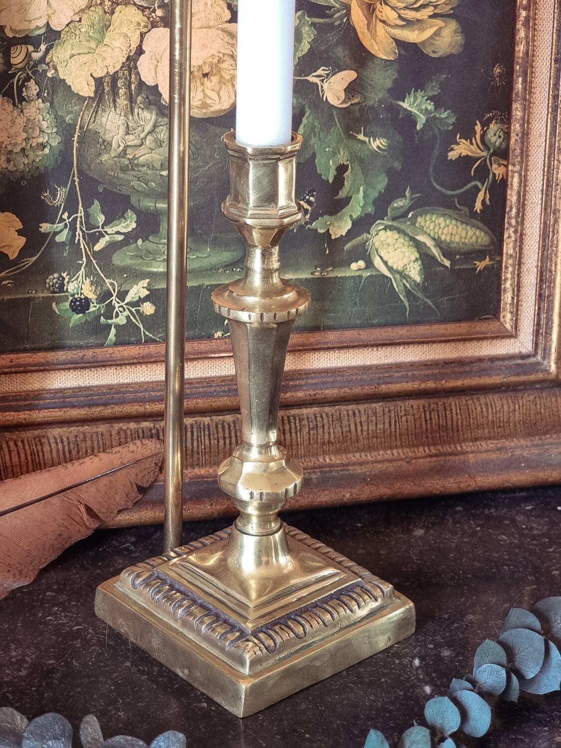 Candle holder with snuffer