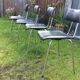 4 Chairs with chrome tubular metal base and black Skaï