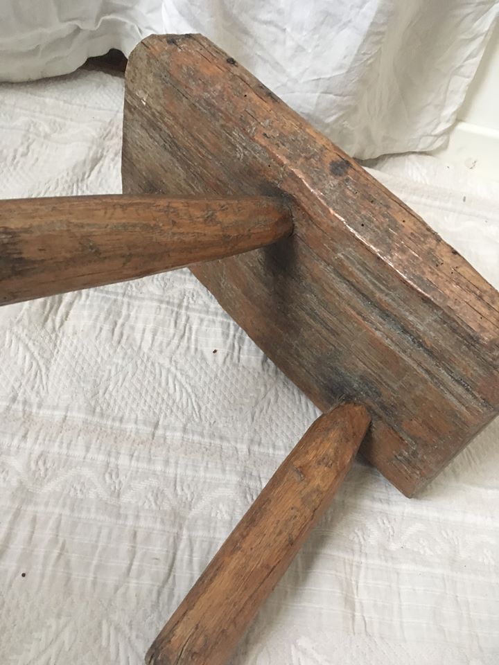 Crude wooden tripod stool