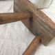 Crude wooden tripod stool