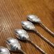 6 long silver-plated metal spoons