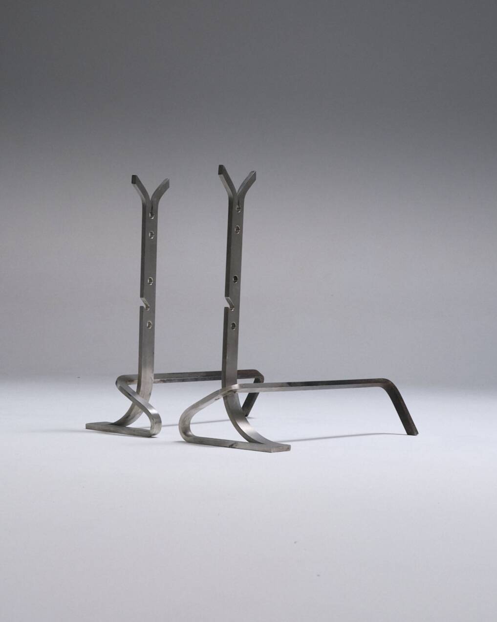 Pair of modernist brushed steel andirons, 1970s