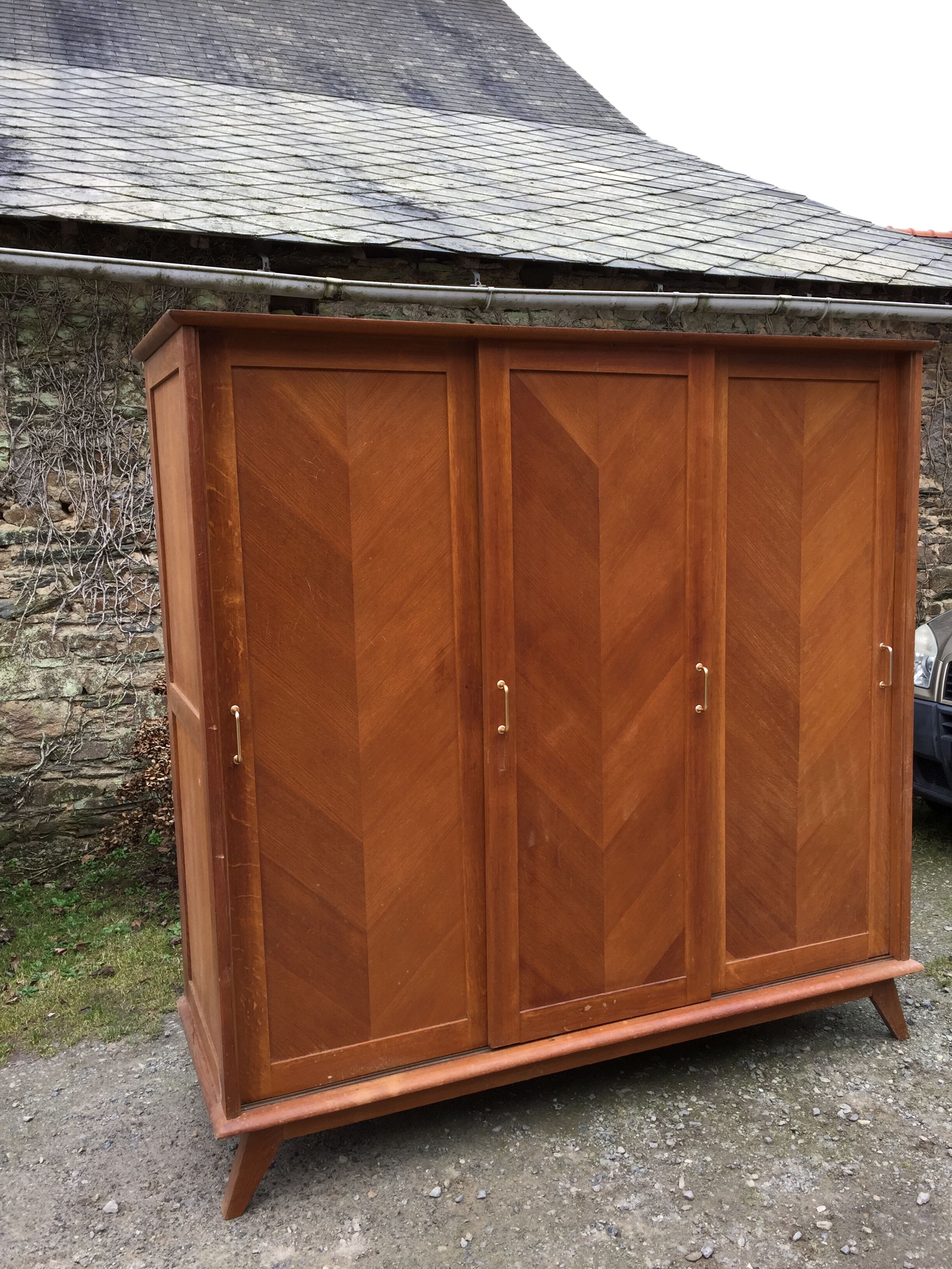 Vintage wardrobe compass feet with 3 sliding oak doors.