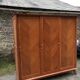 Vintage wardrobe compass feet with 3 sliding oak doors.