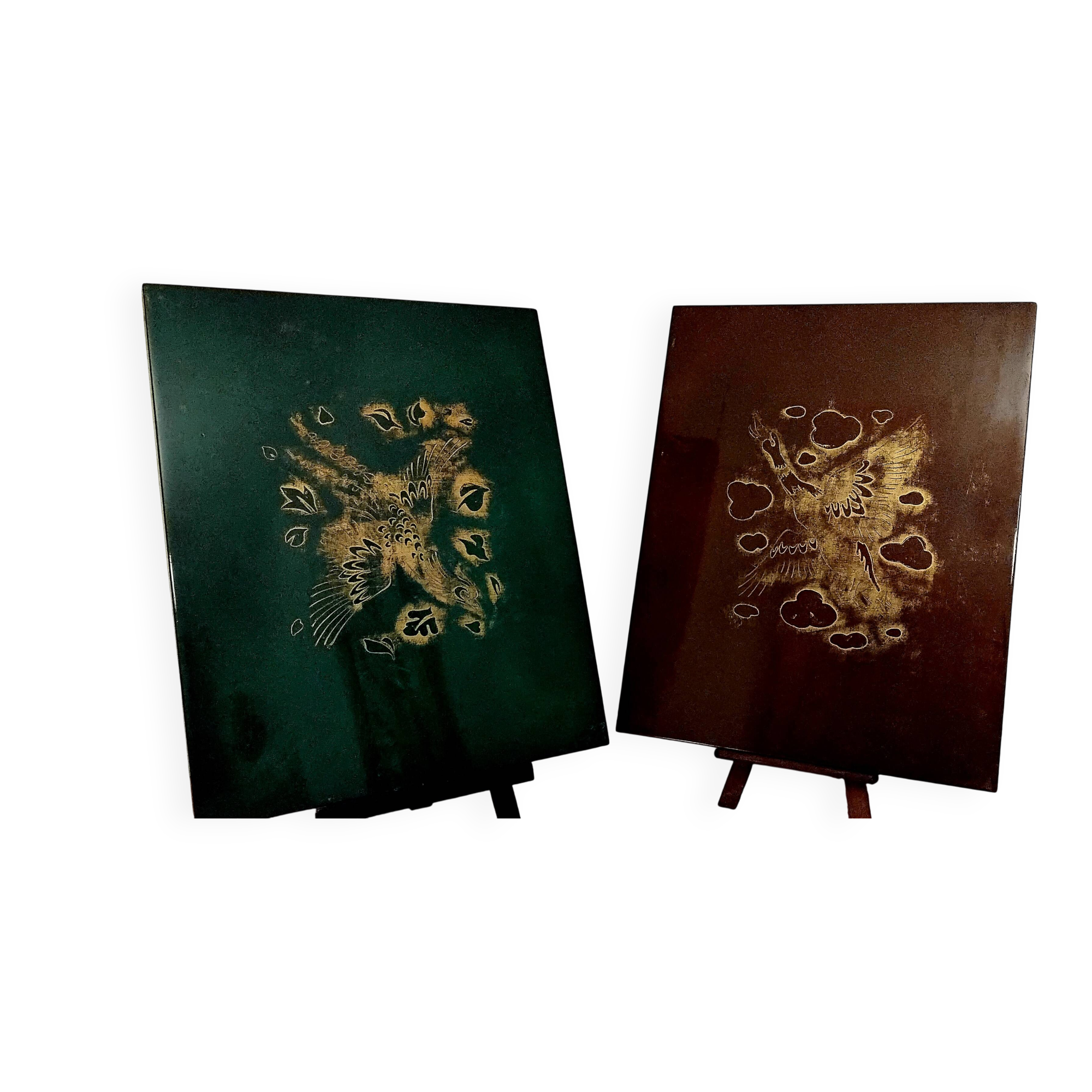 Two panels in lacquer and gold by Pierre Bobot.