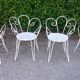 Salon de jardin 1 table 4 fauteuils en fer forgé blanc ancien.