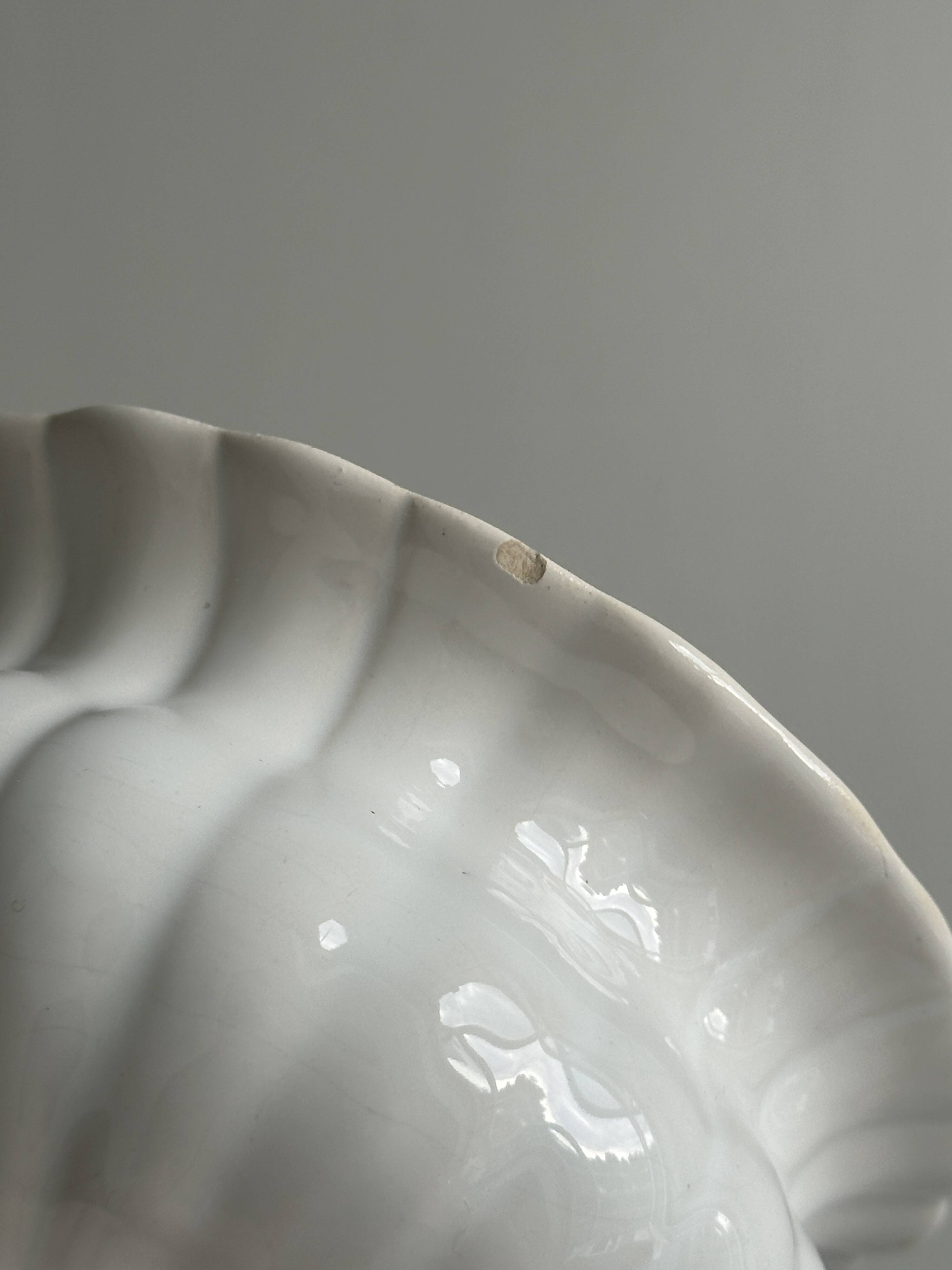 Small white ceramic flowerpot or bowl on foot