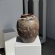 Large traditional Indonesian clay pot featuring a dragon.