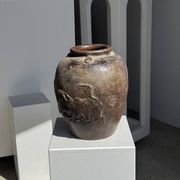 Large traditional Indonesian clay pot featuring a dragon.