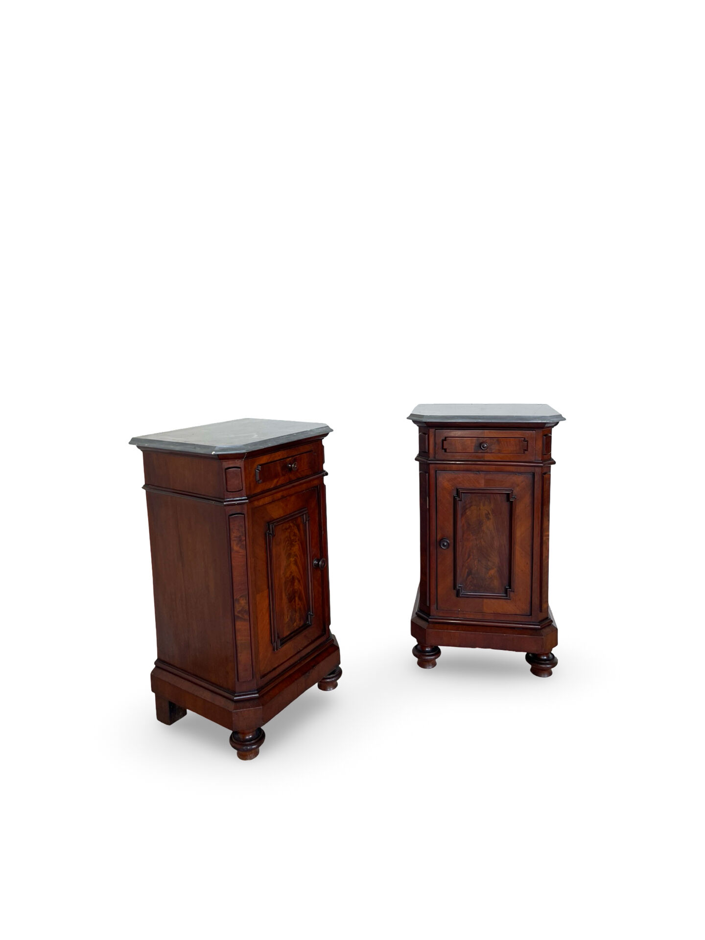 A pair of antique walnut bedside tables from the 1890s.