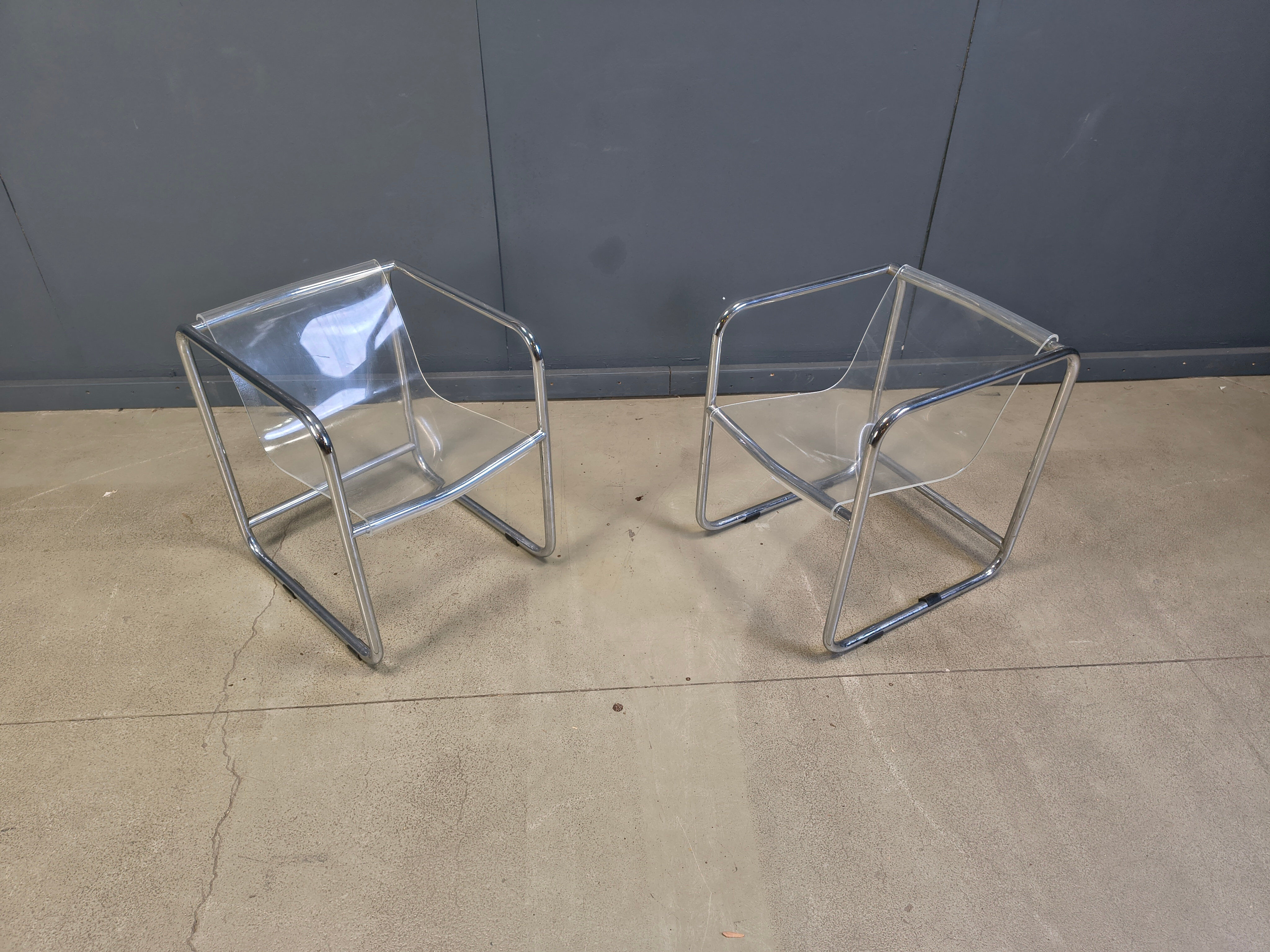 Pair of plexiglass and tubular chrome armchairs, 1970s
