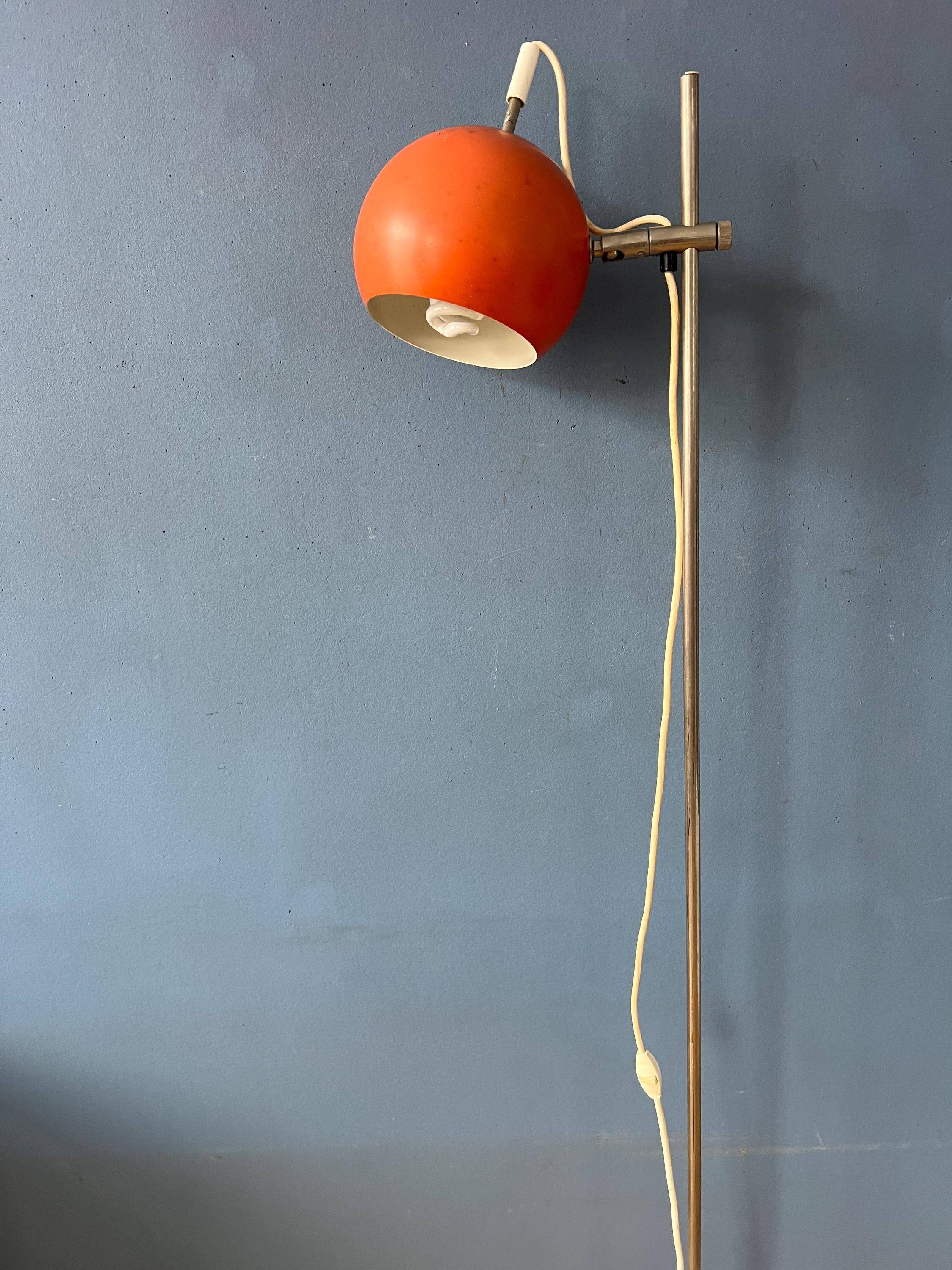 Mid-Century orange floor lamp with "eyeball" shade