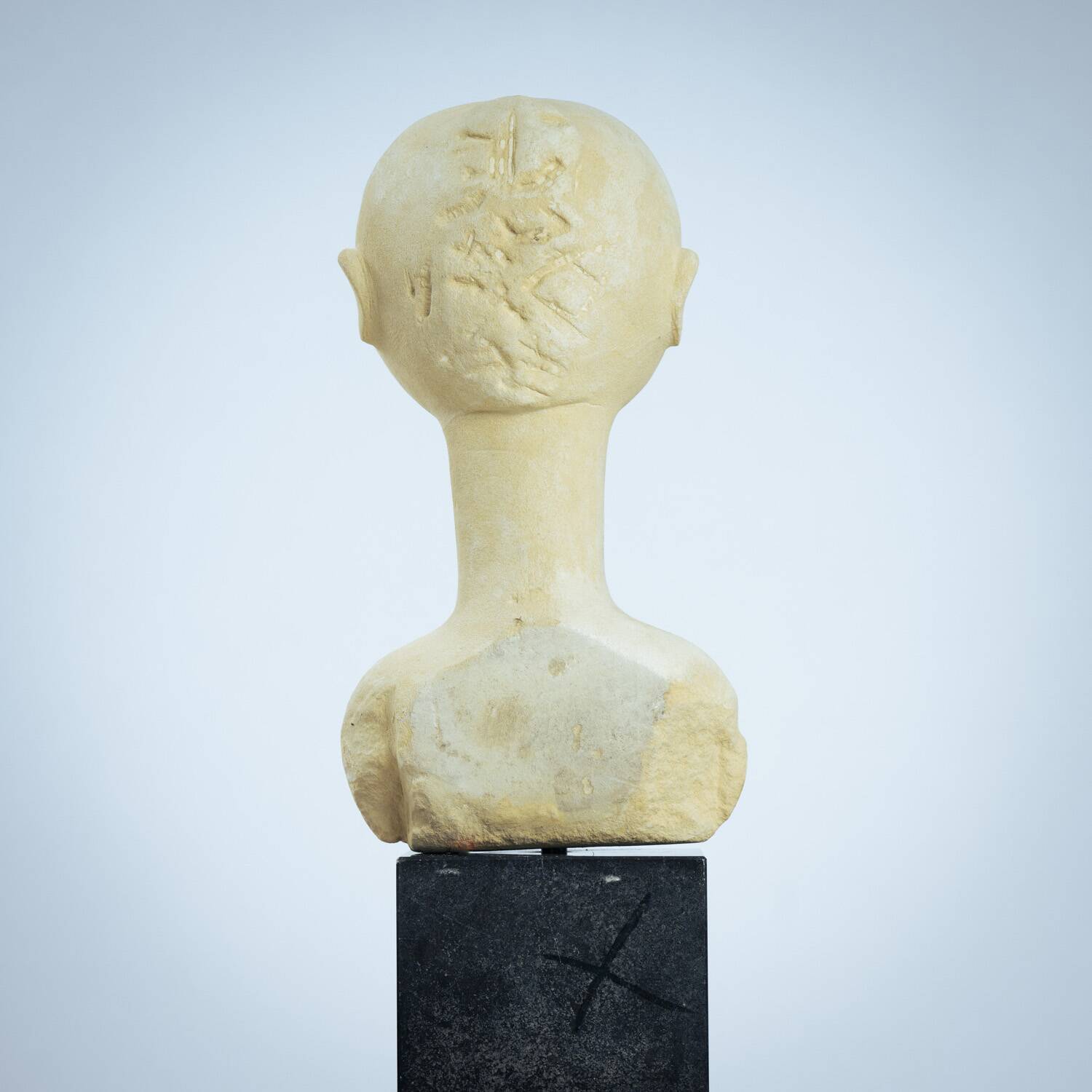 Modernist bust sculpture of a woman in sandstone