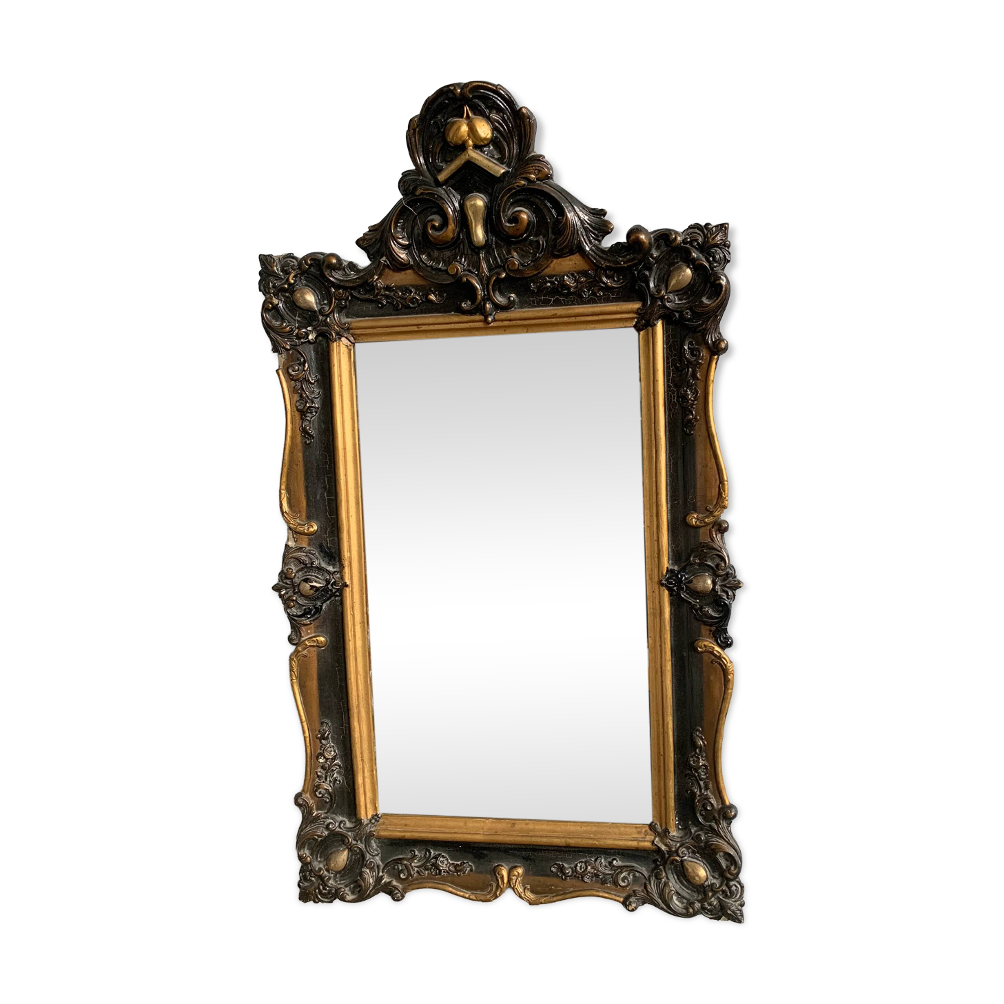 Antique bevelled mirror from the 19th century, sculpted and gilded frame.