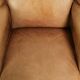 Set of two light cowhide wingback armchairs with a timeless English look