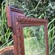 Antique carved wooden mirror