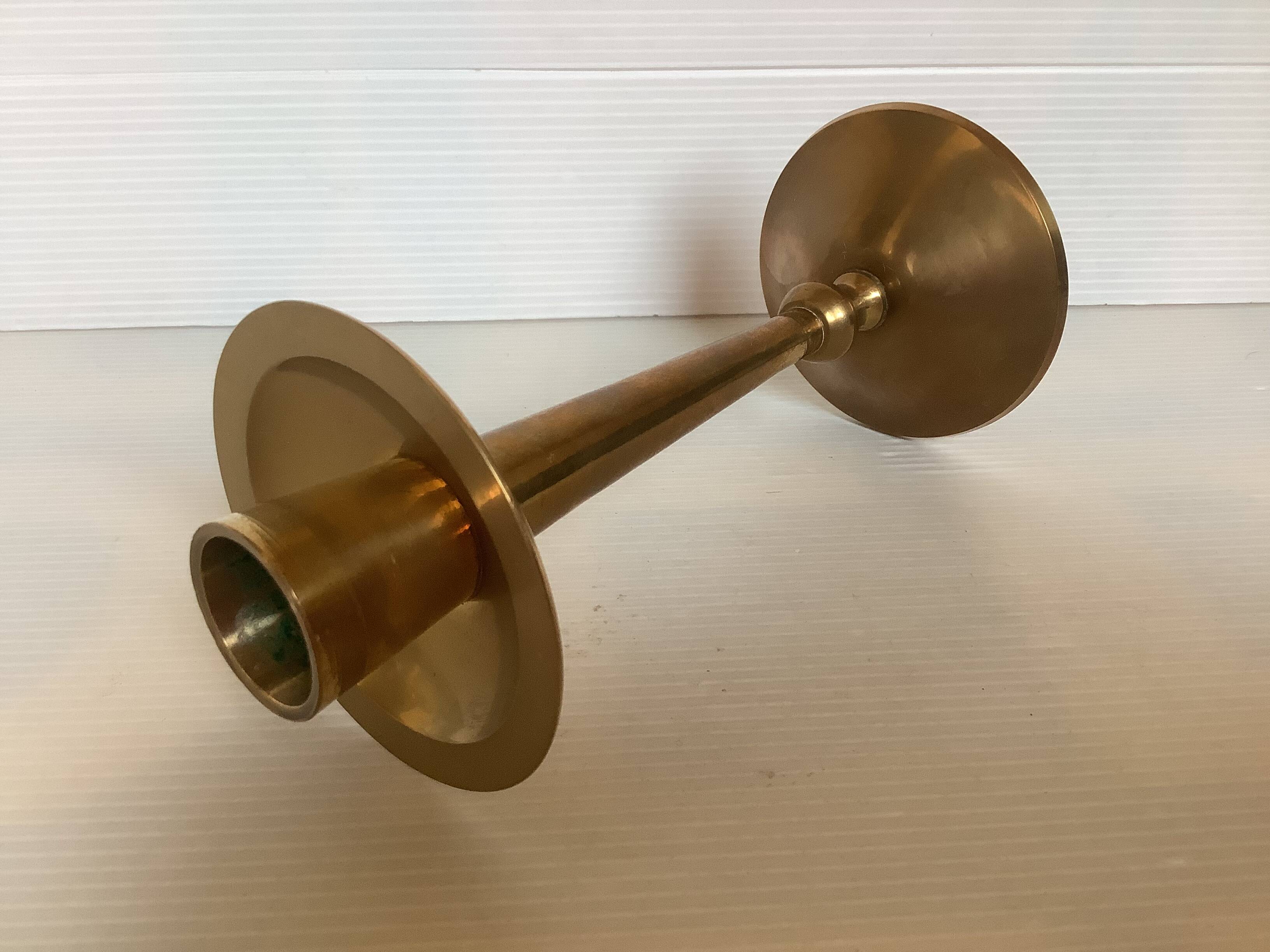 Asymmetrical brass candle holder