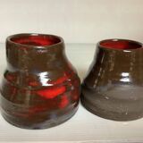 Pair of red vases in the shape of an elephant's foot