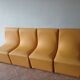 Set of 4 vintage 70s/80s armchairs in mustard yellow faux leather.