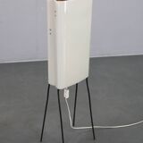Mid-century modern floor lamp on iron legs with plastic shade and wood accent