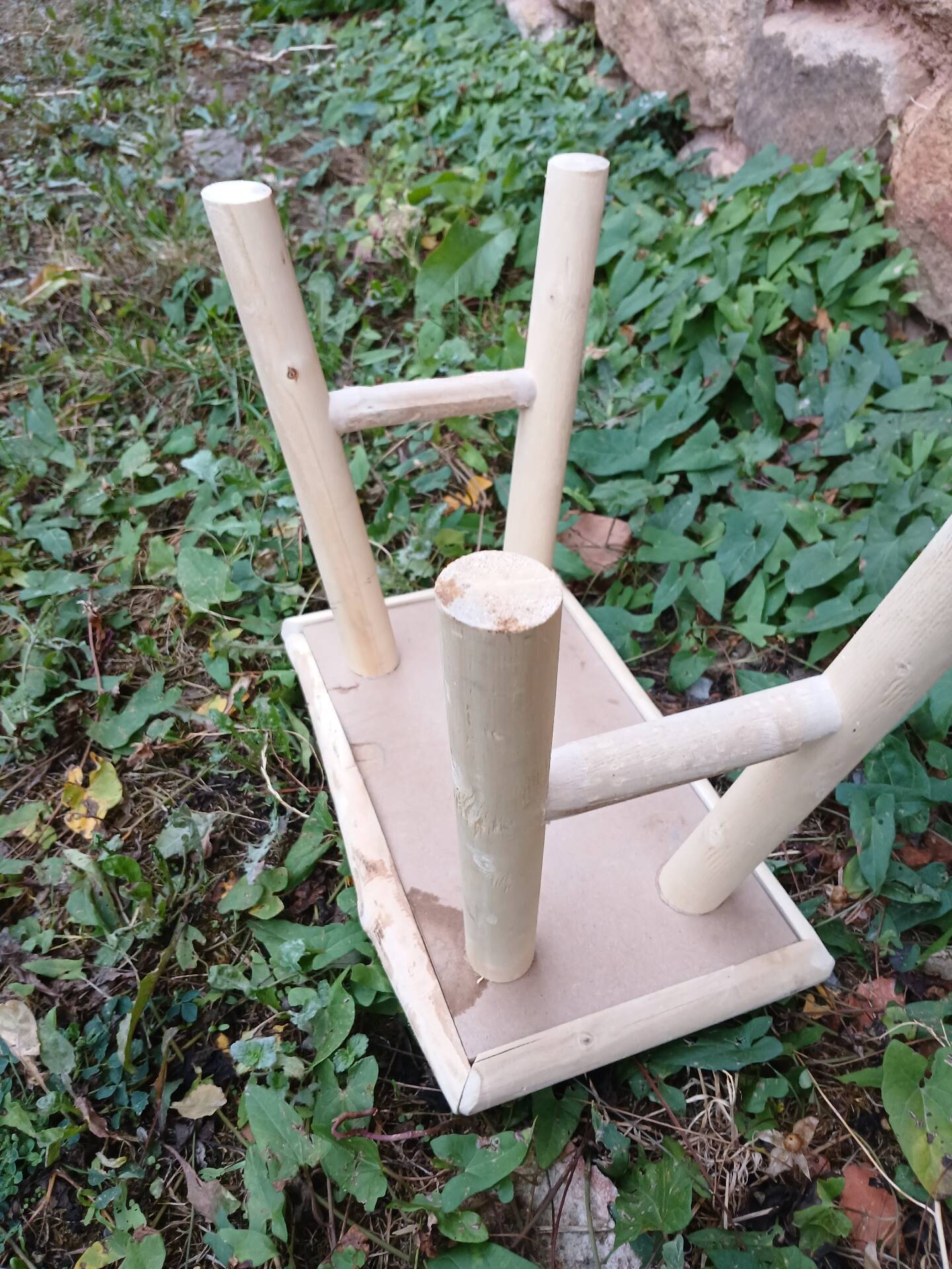 Small stool in raw wood