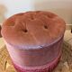 Pouf or footrest in pink velvet with fringes