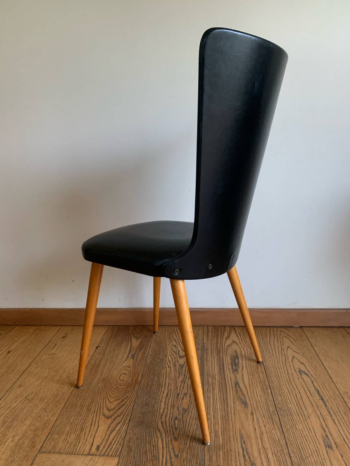Black chair with compass legs
