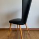 Black chair with compass legs