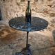 Old French bistro table with a marble top and a cast iron base.
