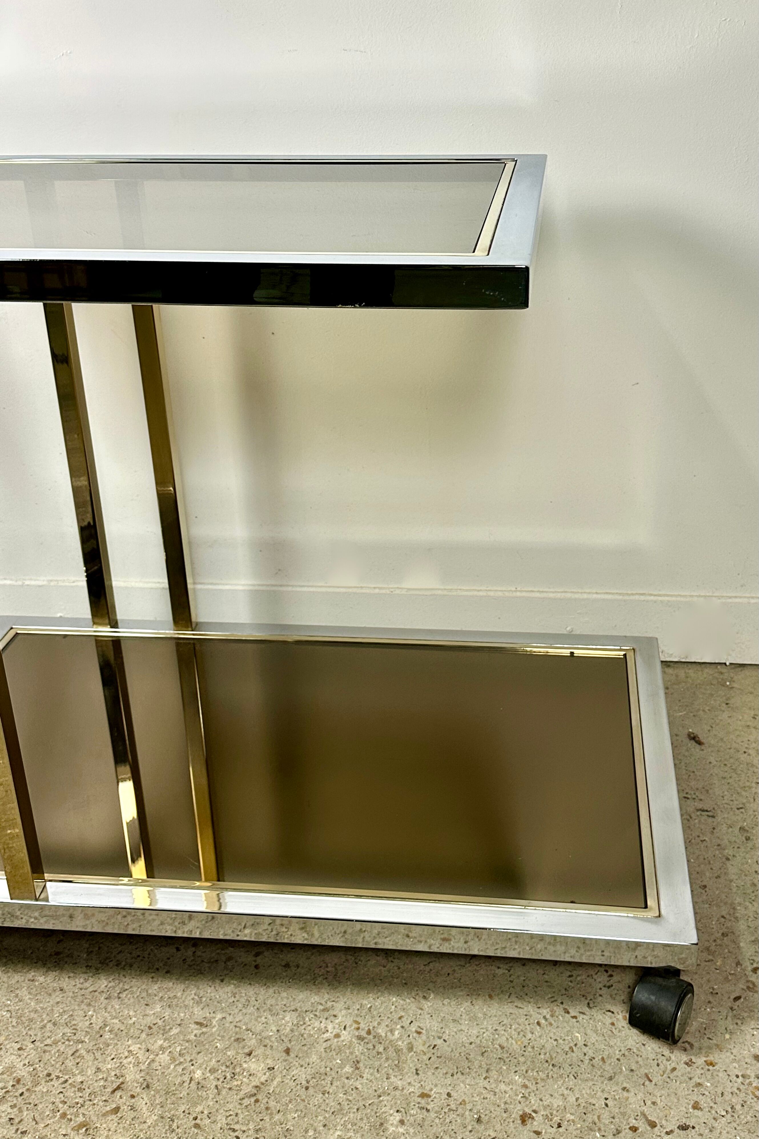 Belgo chrome serving cart/rolling table in chromed and gold-plated brass, 70s