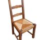 Set of 6 wooden chairs with straw seats and high backs.