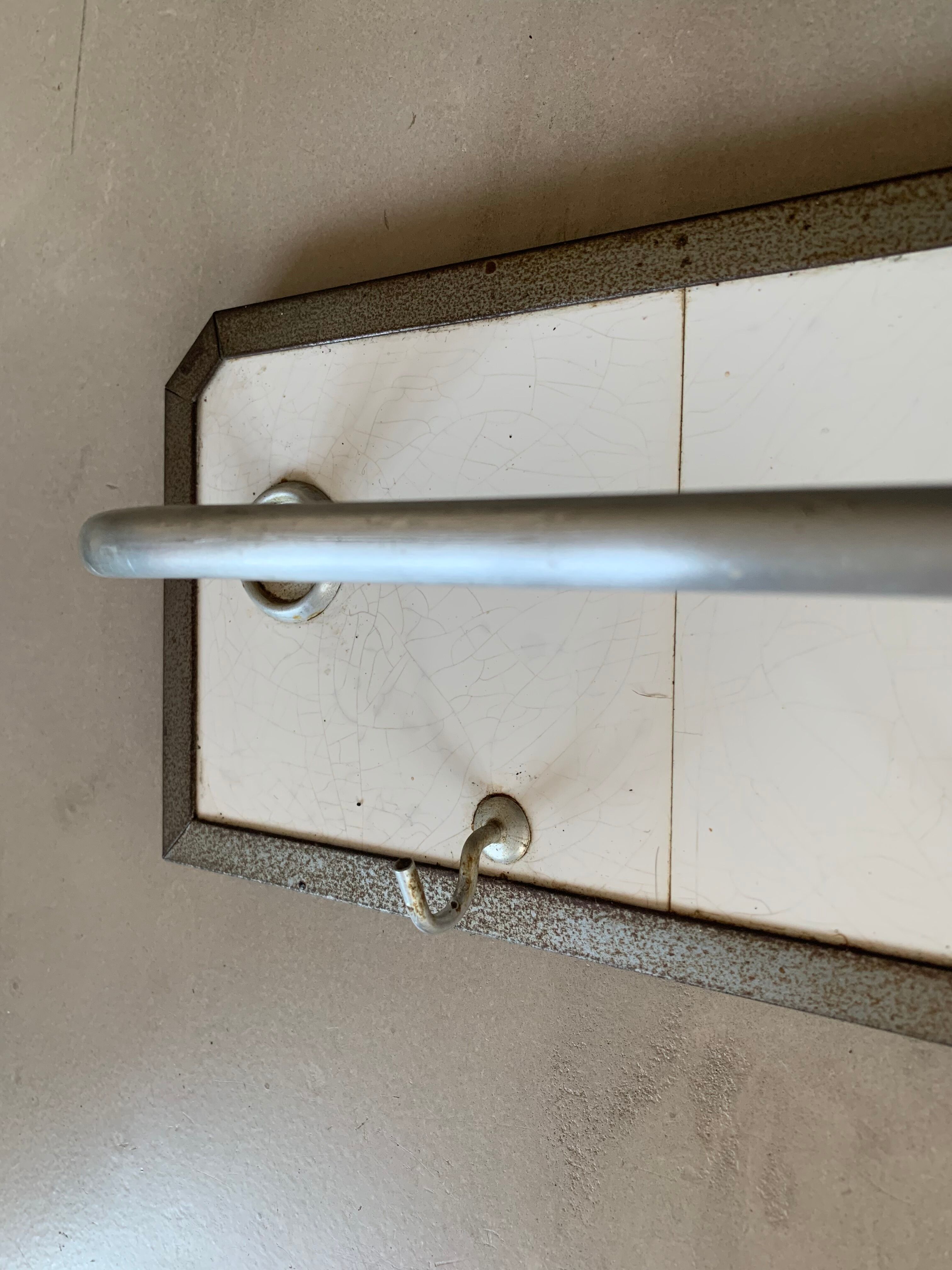 Antique tiled tea towel holder