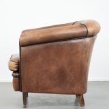 Sturdy vintage sheepskin club armchair with a beautiful patina