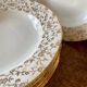 Set of 6 hollow plates in white and gold porcelain