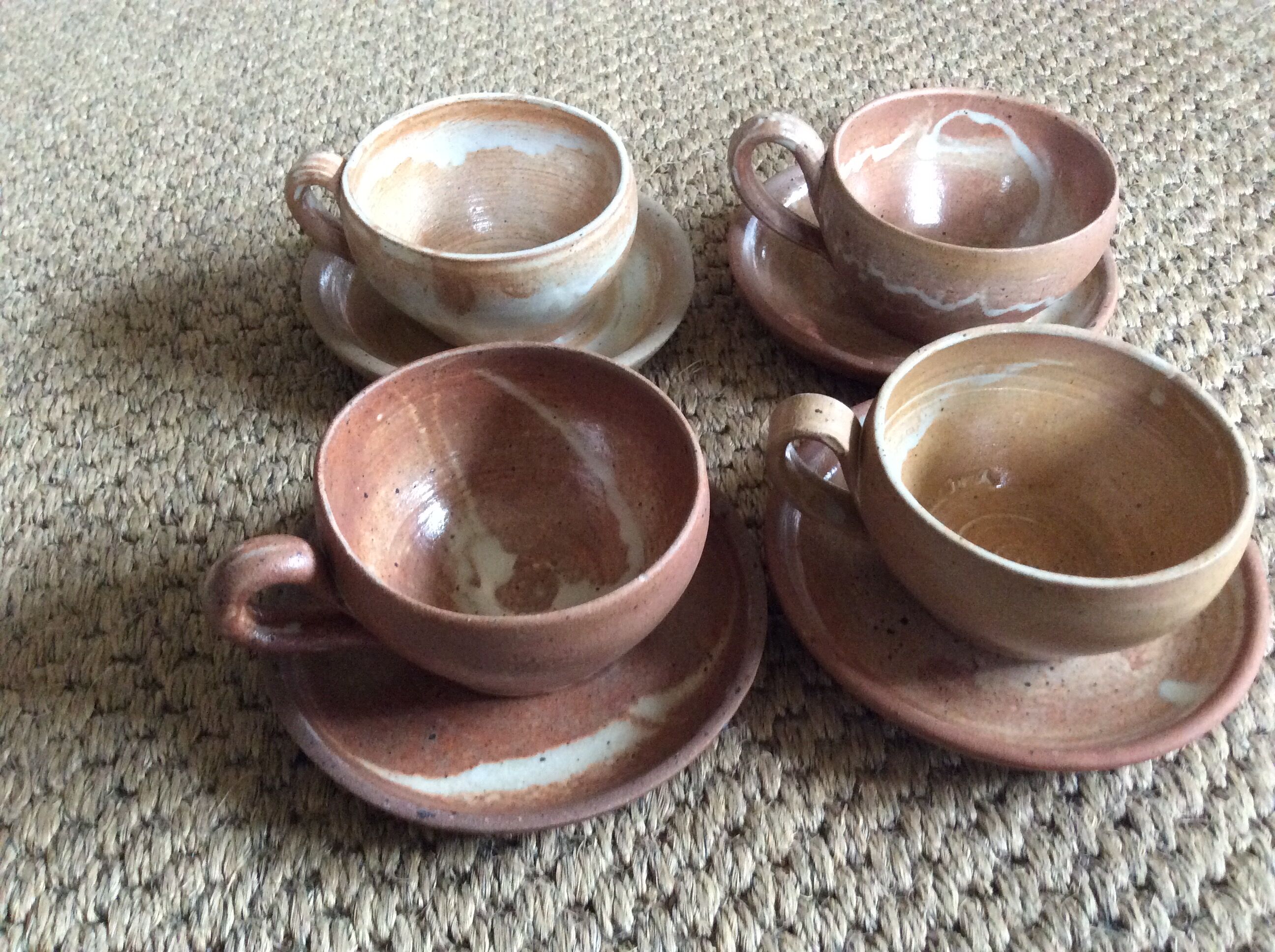 Series of 4 stoneware coffee cups