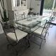 Roche Bobois glass and steel dining table and 6 chairs