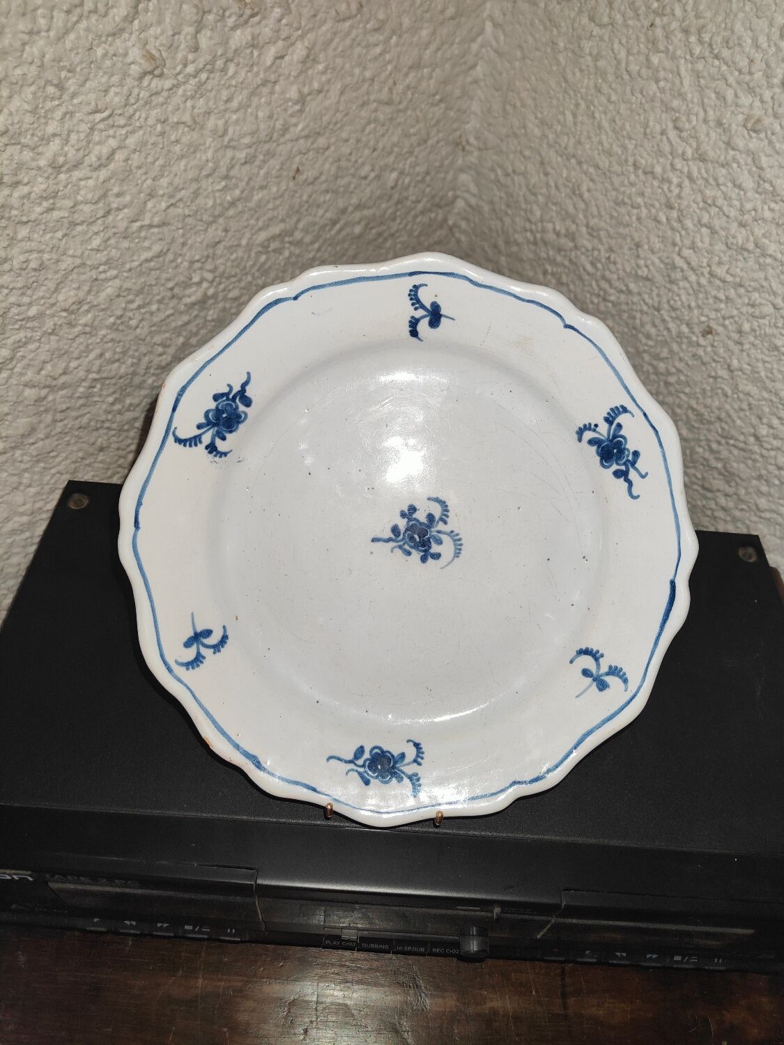 Old plate in Northern earthenware with blue floral decoration eighteenth century