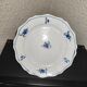 Old plate in Northern earthenware with blue floral decoration eighteenth century