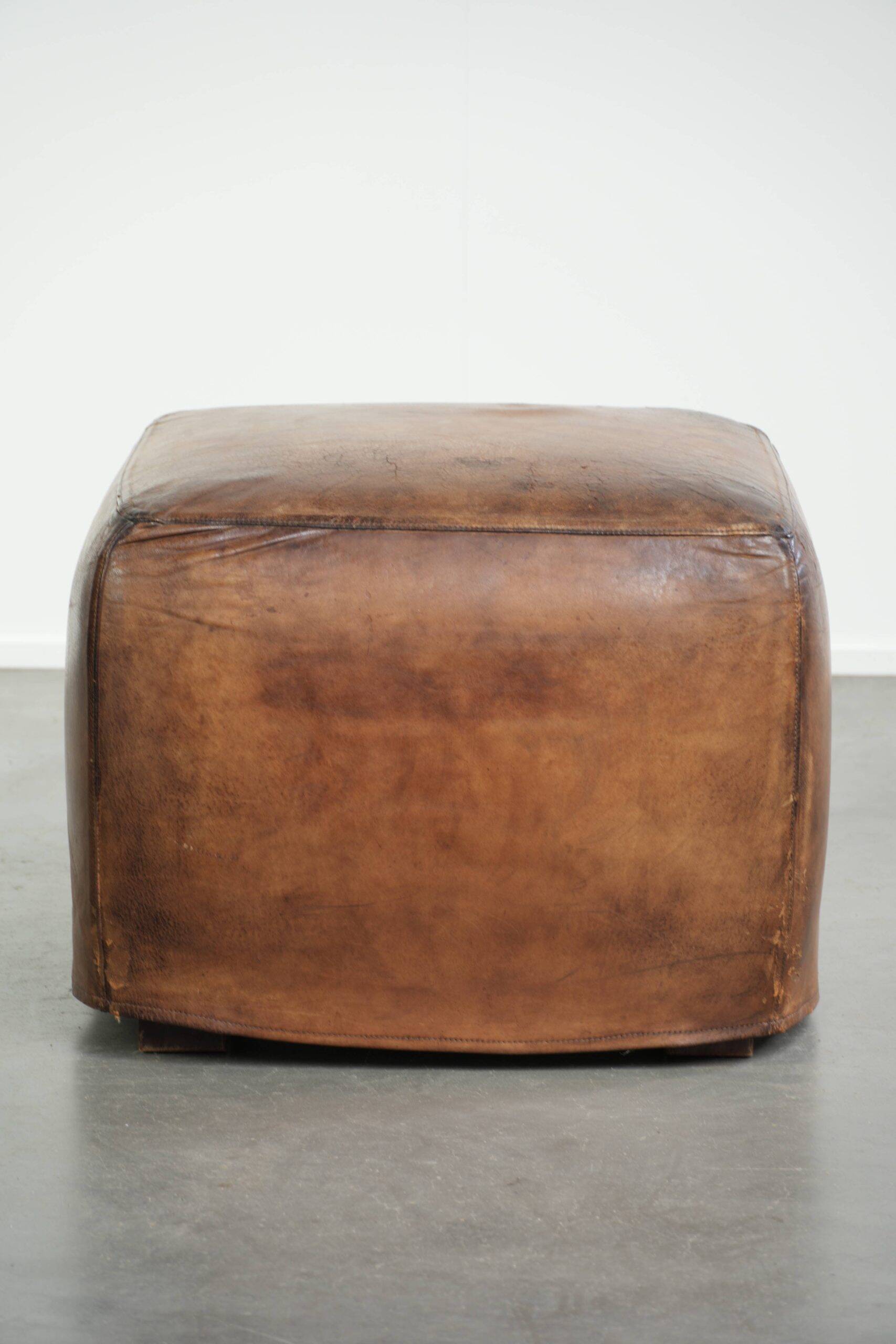 Sheepskin design ottoman with a very beautiful patina and stunning colours