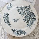 Plat de service rond terre de fer Badonviller modèle Jasmin motif fleuri papillon fin XIXème