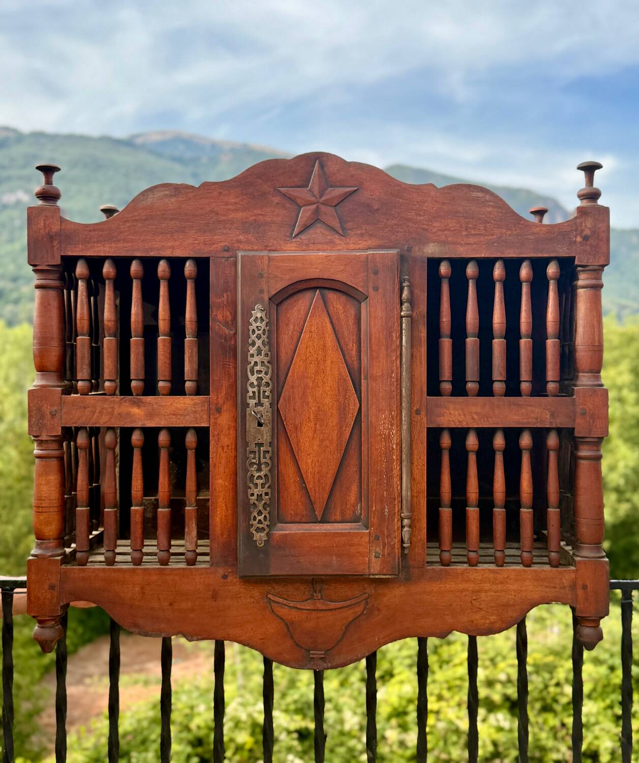 Molded and carved walnut panetière, 19th century.