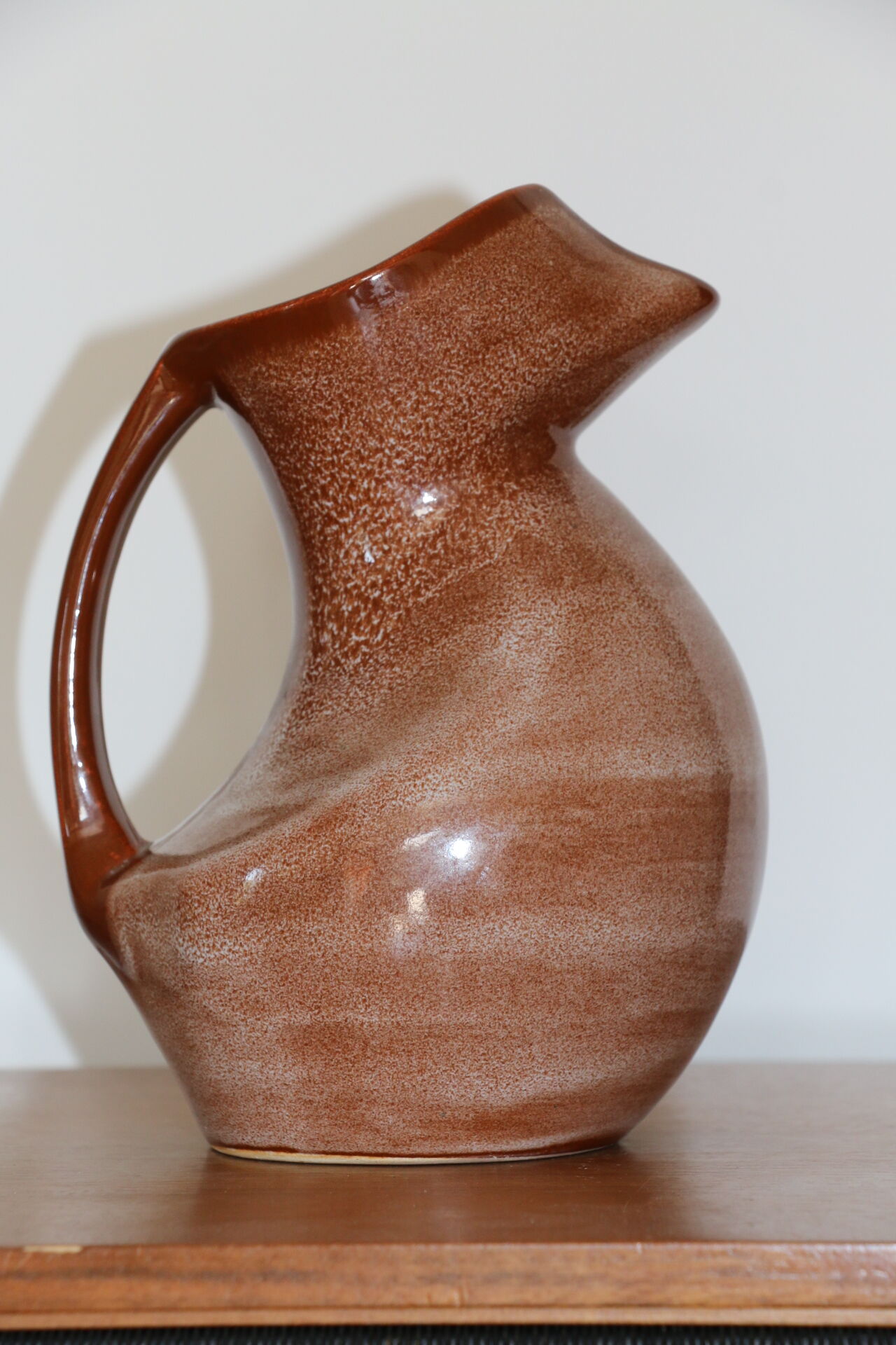 Brown painted earthenware pitcher