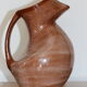 Brown painted earthenware pitcher