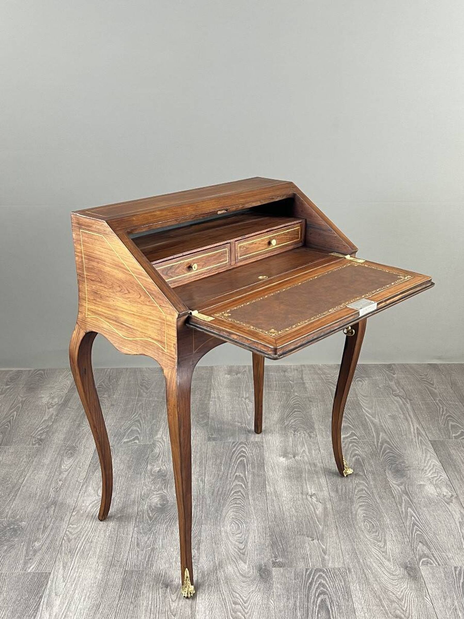 Secretary with a drop-down front in marquetry, Louis XV style, 19th century.