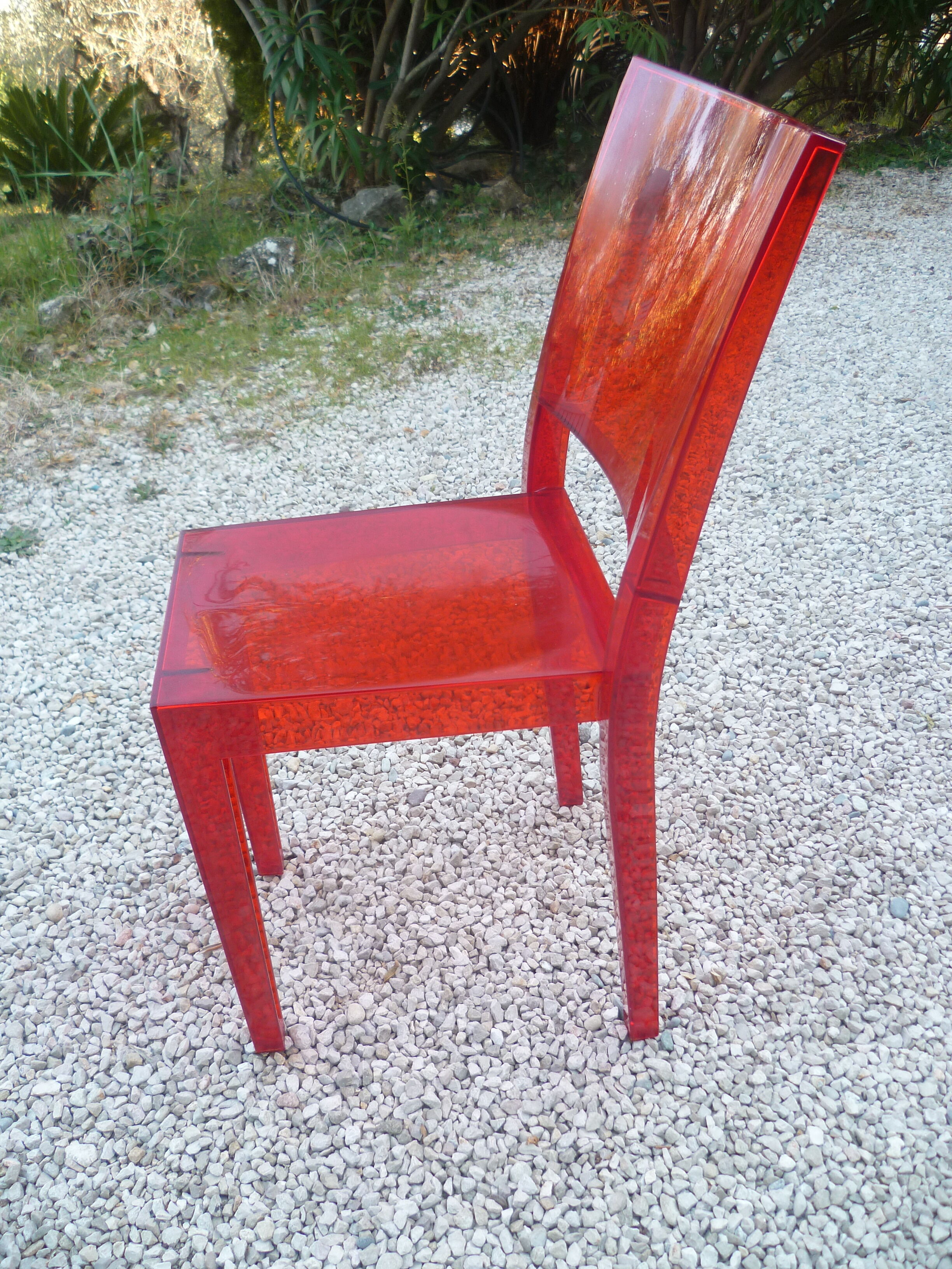 Orange design chair in polycarbonate plexiglass
