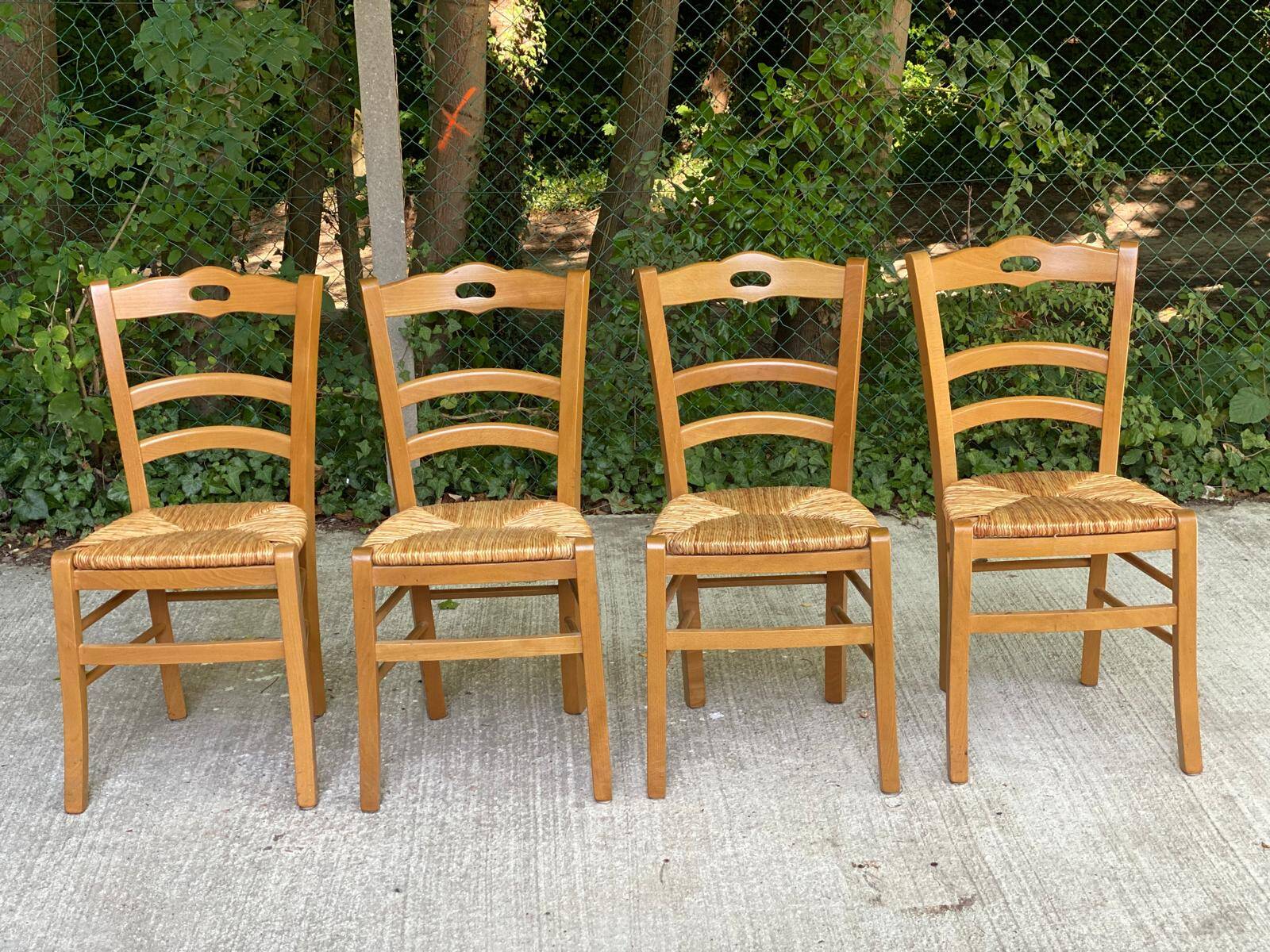 4 solid wood chairs in blond oak and straw shell