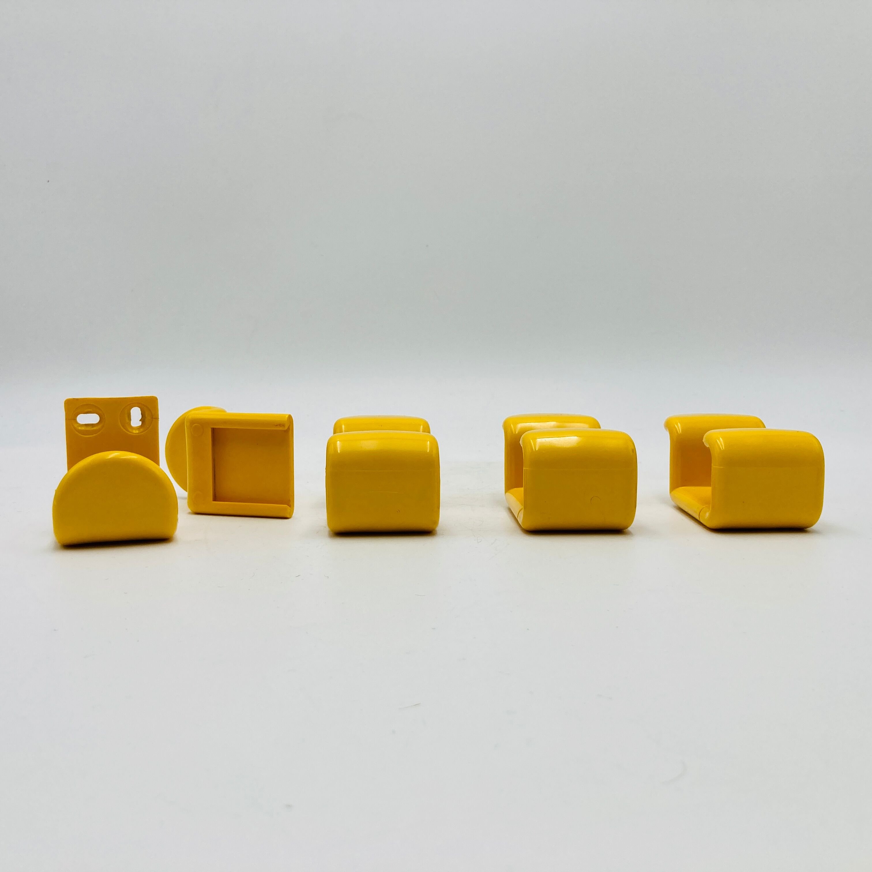 Yellow plastic hooks, design A. Rossari, Gedy edition.