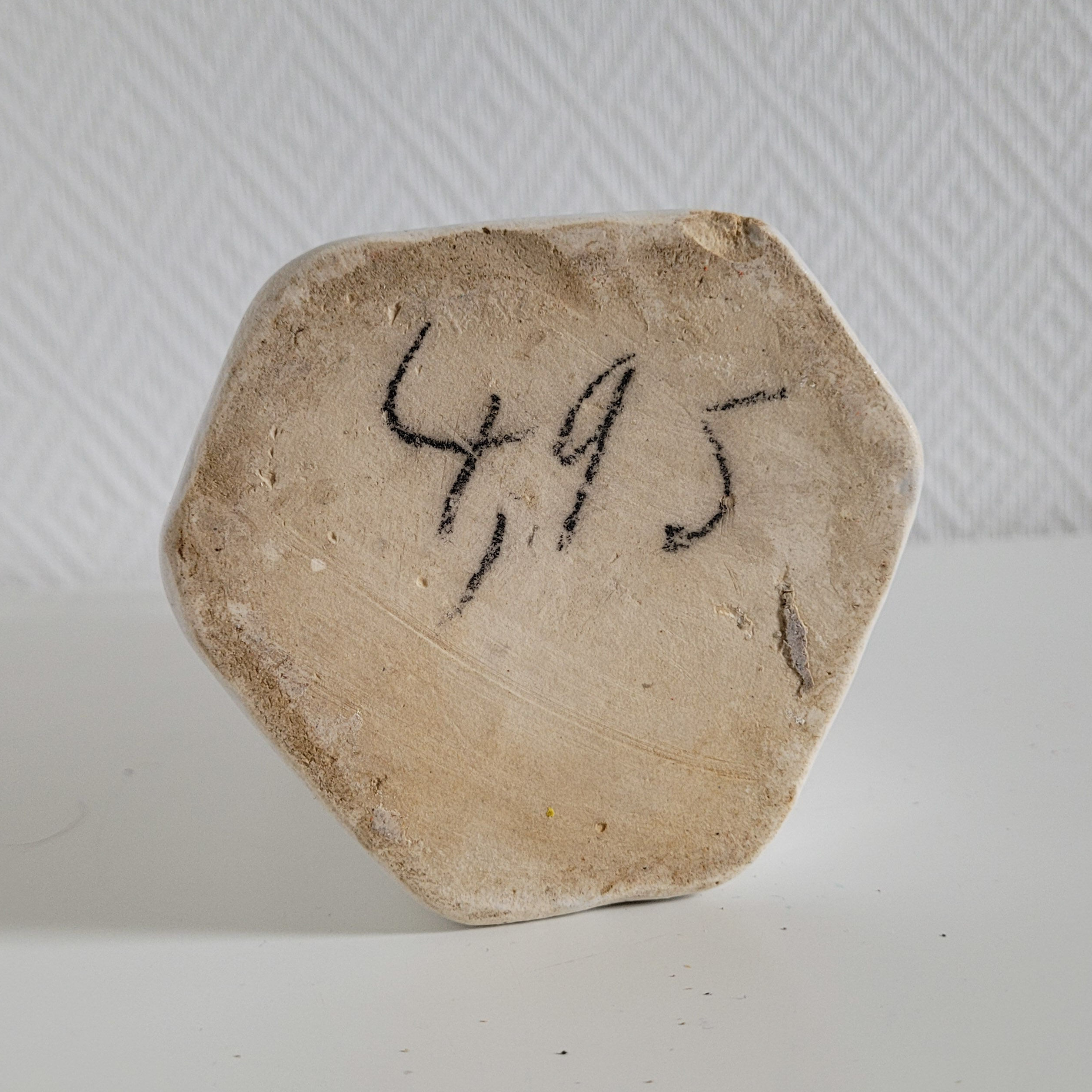 Old hexagonal sandstone bottles