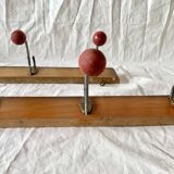 Pair of vintage wooden wall coat racks with three red ball hooks