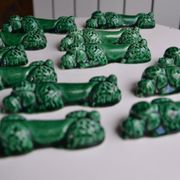 12 green earthenware knife rests